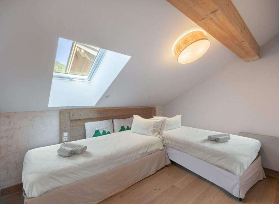 This cozy bedroom features two twin beds, perfect for guests or a shared living space.