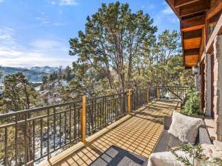Enjoy breathtaking mountain views from this stunning deck.