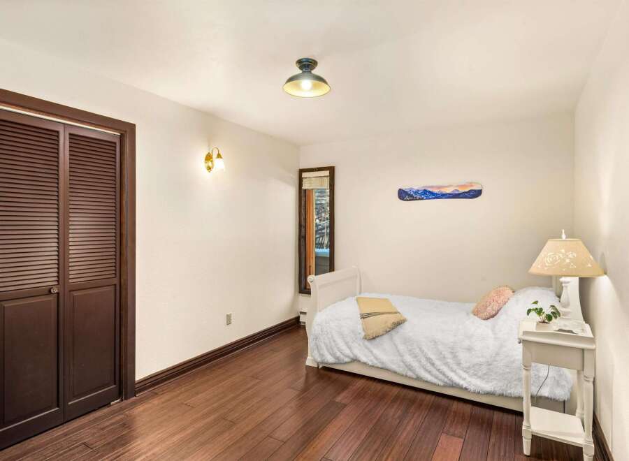 This cozy bedroom features a plush, inviting bed, perfect for relaxation.