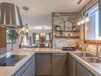 This stunning kitchen boasts a modern design with a touch of rustic charm.