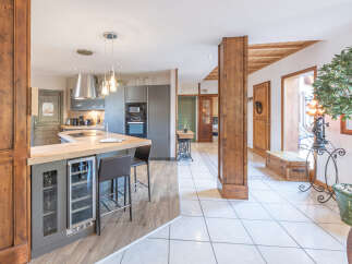 This stunning property boasts a beautifully designed kitchen with modern appliances and ample counter space, perfect for culinary enthusiasts.