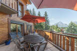 Enjoy breathtaking mountain views from this charming balcony.