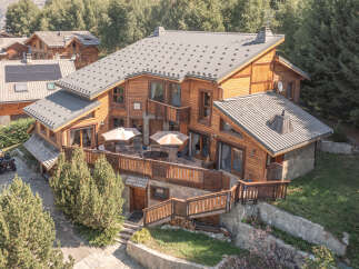 Discover the charm of this stunning wooden chalet, nestled in a serene, tree-lined setting.