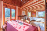 This charming wooden cabin offers a cozy and inviting atmosphere, perfect for a relaxing getaway.