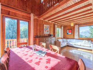 This charming wooden cabin offers a cozy and inviting atmosphere, perfect for a relaxing getaway.