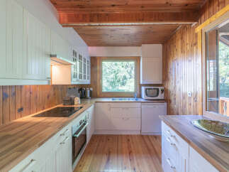 This charming kitchen boasts a warm and inviting atmosphere, perfect for culinary adventures.