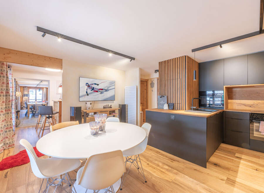 Experience modern living in this stunning property, featuring a stylish kitchen with sleek cabinetry and a cozy dining area perfect for entertaining.