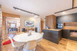 Experience modern living in this stunning property, featuring a stylish kitchen with sleek cabinetry and a cozy dining area perfect for entertaining.