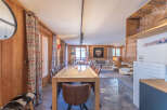 Experience the charm of this stunning property, featuring a spacious dining area perfect for gatherings.