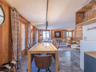 Experience the charm of this stunning property, featuring a spacious dining area perfect for gatherings.