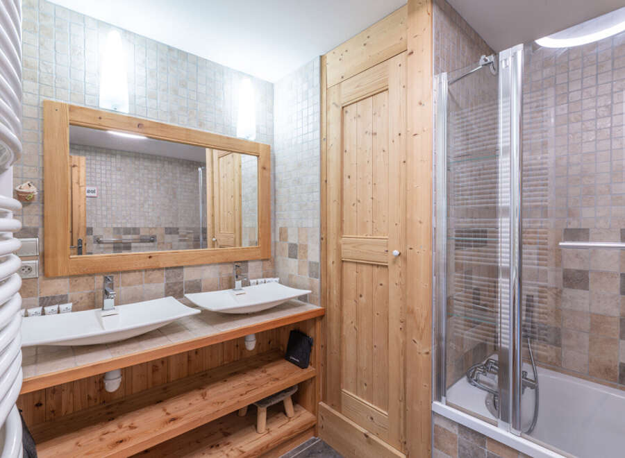 This stunning bathroom features a modern design with a touch of rustic charm.