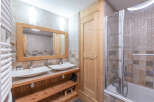 This stunning bathroom features a modern design with a touch of rustic charm.