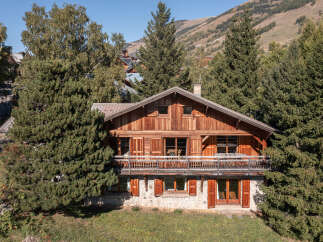 Discover the charm of this stunning wooden chalet nestled amidst the serene mountains.