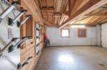 This spacious garage offers ample storage and a unique design.