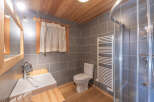 This charming bathroom features a modern design with a touch of rustic elegance.