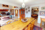 Step into this charming home and be captivated by its inviting dining area, perfect for gatherings.