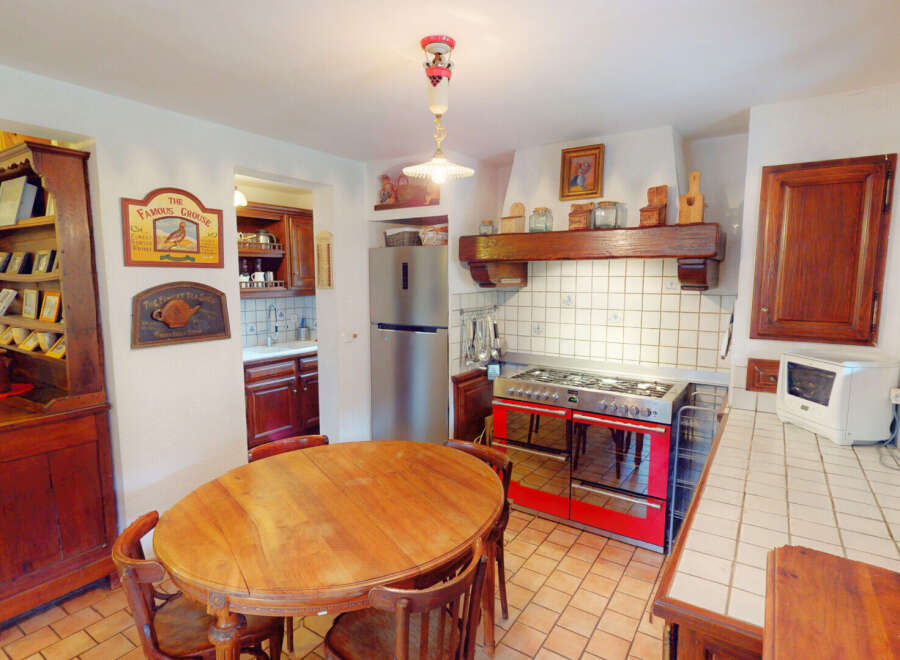 Step into this charming kitchen, featuring a classic design with a touch of rustic elegance.