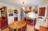 Step into this charming kitchen, featuring a classic design with a touch of rustic elegance.