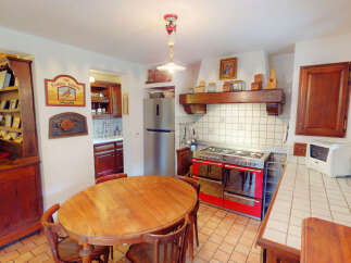 Step into this charming kitchen, featuring a classic design with a touch of rustic elegance.