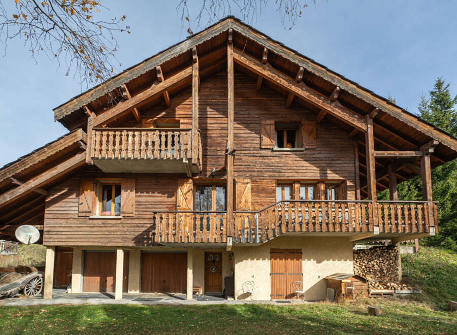 This stunning wooden chalet offers a warm and inviting atmosphere, perfect for a mountain retreat.