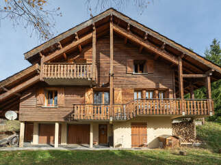 This stunning wooden chalet offers a warm and inviting atmosphere, perfect for a mountain retreat.