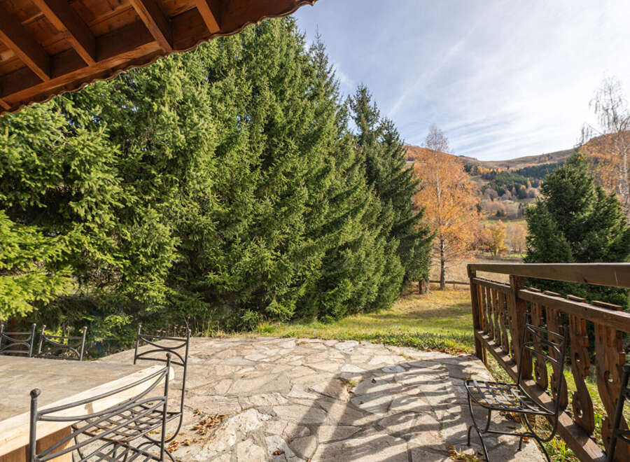 Enjoy the tranquility of this stunning property, featuring a beautifully designed patio and lush surroundings.