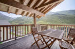 Enjoy breathtaking mountain views from this stunning balcony.