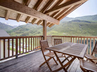 Enjoy breathtaking mountain views from this stunning balcony.