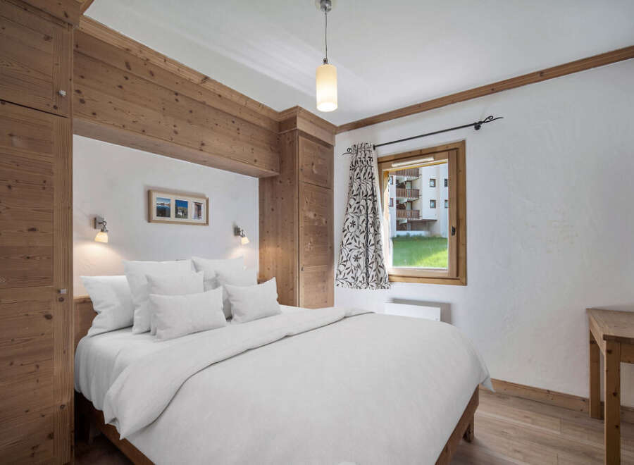 Experience the charm of this cozy bedroom, featuring a comfortable bed and ample natural light.