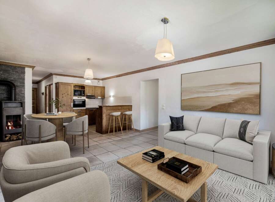 Discover the charm of this inviting living space, featuring a cozy fireplace and a well-equipped kitchen.
