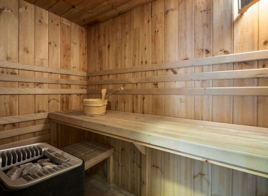 Step into relaxation with this stunning sauna! Featuring beautiful wooden interiors and comfortable seating, this space is perfect for unwinding.