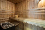 Step into relaxation with this stunning sauna! Featuring beautiful wooden interiors and comfortable seating, this space is perfect for unwinding.