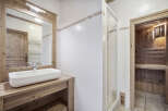 This stunning bathroom features a modern design with a touch of rustic charm.
