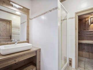 This stunning bathroom features a modern design with a touch of rustic charm.