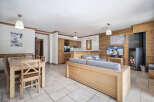 Experience the charm of this stunning property, featuring a cozy living area with a fireplace and a modern kitchen.