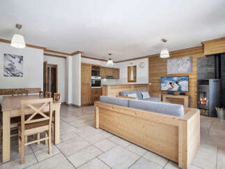 Experience the charm of this stunning property, featuring a cozy living area with a fireplace and a modern kitchen.