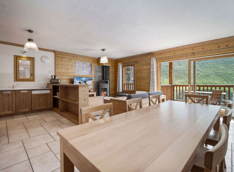 Experience the charm of this stunning property, featuring a spacious living area with a cozy fireplace and a modern kitchen.