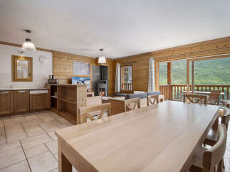 Experience the charm of this stunning property, featuring a spacious living area with a cozy fireplace and a modern kitchen.