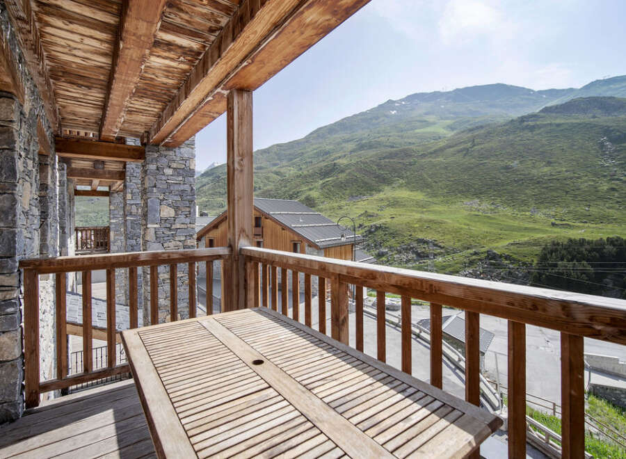 Enjoy breathtaking mountain views from this stunning balcony.
