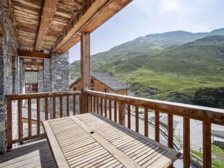 Enjoy breathtaking mountain views from this stunning balcony.