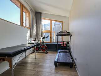 This home gym offers a dedicated space for fitness enthusiasts.