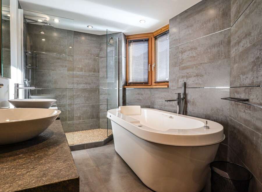Indulge in luxury within this stunning bathroom, featuring a sleek, modern design.
