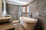 Indulge in luxury within this stunning bathroom, featuring a sleek, modern design.