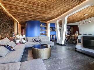 Step into modern luxury with this stunning property, showcasing a unique blend of contemporary design and natural elements.