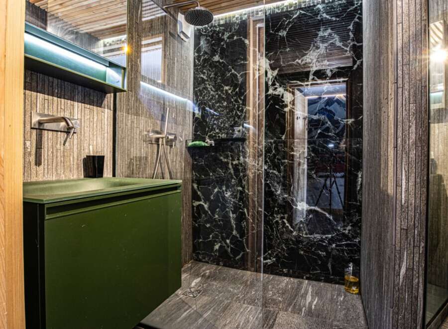 Step into luxury with this stunning bathroom featuring a sleek, modern design.