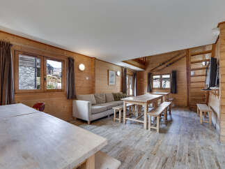 This charming wooden cabin offers a cozy and inviting atmosphere, perfect for a relaxing getaway.