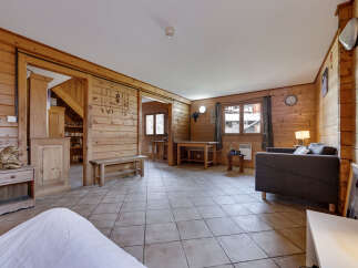 This charming wooden cabin offers a cozy and inviting living space.