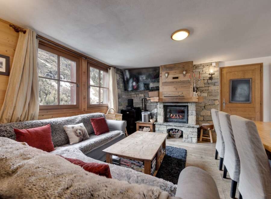 Experience the warmth and charm of this cozy chalet, perfect for a mountain getaway.