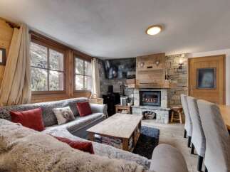 Experience the warmth and charm of this cozy chalet, perfect for a mountain getaway.