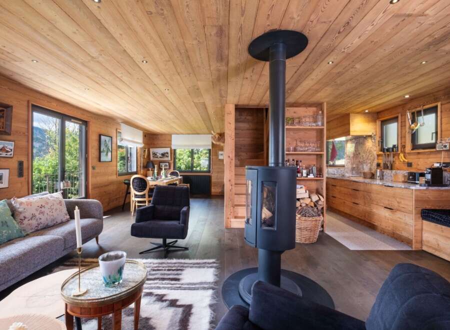 Experience the warmth of this stunning chalet, featuring exquisite wooden interiors and a cozy fireplace.